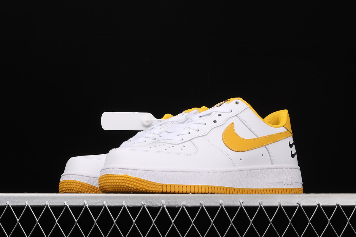 white nike yellow swoosh